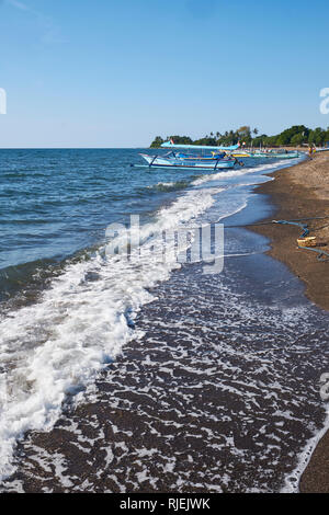 Traditional fishing boats on Lovina beach in North Bali Stock Photo