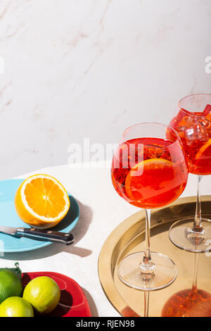 Spritz veneziano, an IBA cocktail, with Prosecco or white sparkling wine, bitter, soda, ice and a slice of orange, in a calix on a table, pop graphic Stock Photo