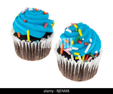 Side view of two blue frosted chocolate cupcakes isolated on a white background. Stock Photo