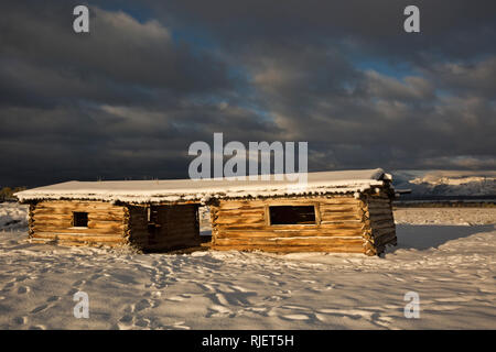 WY03211-00...WYOMING - A stormy morning sunrise at Cunningham Cabin Historic Site In Grand Teton National Park. Stock Photo