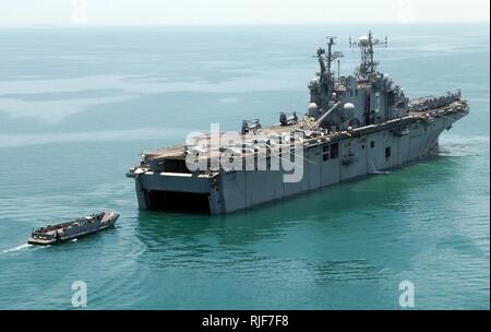 A Landing Craft Utility returns to the well deck of USS