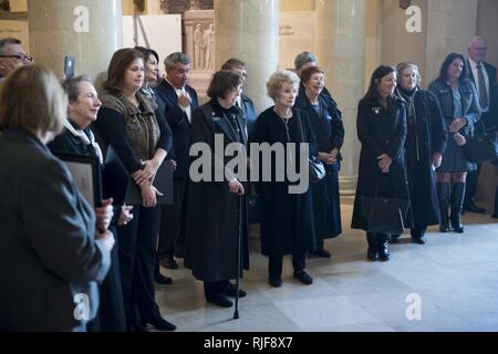 Arlington Ladies listen to Maj. Gen. Bradley A. Becker, commanding general Joint Force Headquarters-National Capital Region and the U.S. Army Military District of Washington, following a wreath laying ceremony at the Tomb of the Unknown Soldier, Nov. 11, 2016, in Arlington, Va. Stock Photo