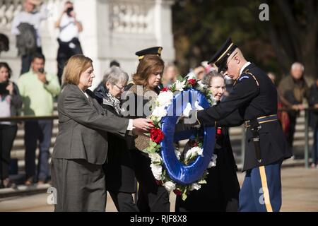 Arlington Ladies place a wreath at the Tomb of the Unknown Soldier at Arlington National Cemetery, Nov. 11, 2016, in Arlington, Va. by Maj. Gen. Bradley A. Becker, commanding general Joint Force Headquarters-National Capital Region and the U.S. Army Military District of Washington, escorted the ladies. Stock Photo