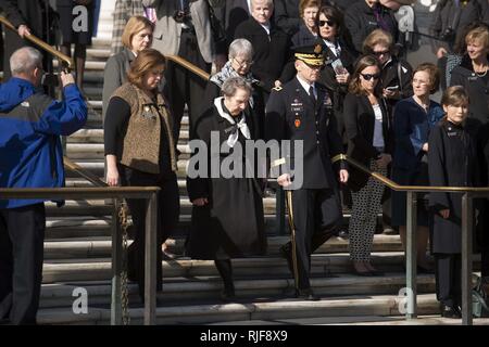 Members of the Arlington Ladies are escorted by Maj. Gen. Bradley A. Becker, commanding general Joint Force Headquarters-National Capital Region and the U.S. Army Military District of Washington, to the Tomb of the Unknown Soldier at Arlington National Cemetery, Nov. 15, 2016, in Arlington, Va. The Arlington Ladies placed a wreath at the Tomb. Stock Photo