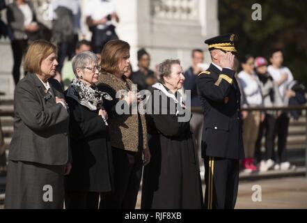 Members of the Arlington Ladies are escorted by Maj. Gen. Bradley A. Becker, commanding general Joint Force Headquarters-National Capital Region and the U.S. Army Military District of Washington, to the Tomb of the Unknown Soldier at Arlington National Cemetery, Nov. 15, 2016, in Arlington, Va. The Arlington Ladies placed a wreath at the Tomb. Stock Photo