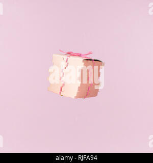 Seemless pattern of craft  cardboard gift boxes on the solid pink background. Holiday and gift concept. Pop art slyle. Square. Glitch effect, colorful Stock Photo