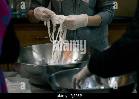 Los Angeles, California, USA. 4th February, 2019. Noodles being prepared at Thien Hau Temple during Chinese Lunar New Year at midnight in preparation for traditional ceremony. Credit: Rommel Canlas/Alamy Live News Stock Photo