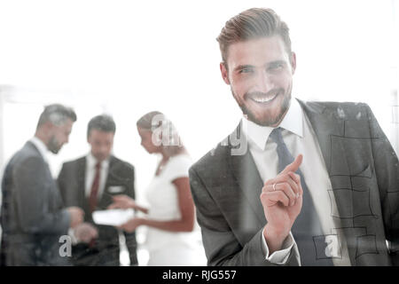 successful businessman touching his finger to the glass Board. Stock Photo
