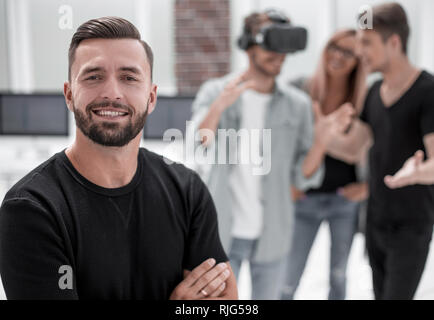 Cheerful colleagues testing virtual reality glasses Stock Photo