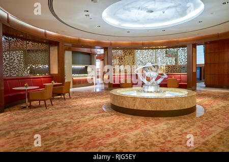 DUBAI, UAE - CIRCA APRIL, 2016: interior of Emirates business class lounge. Emirates is the largest airline in the Middle East. It is an airline based Stock Photo