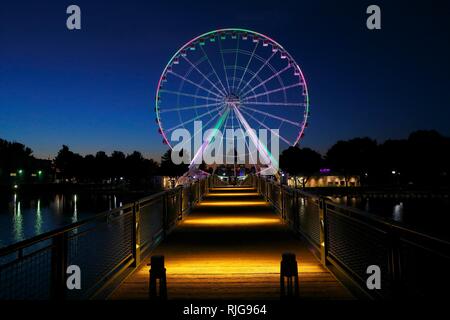 Illuminated Big Wheel at night, Old Port, Montreal, Quebec Province, Canada Stock Photo