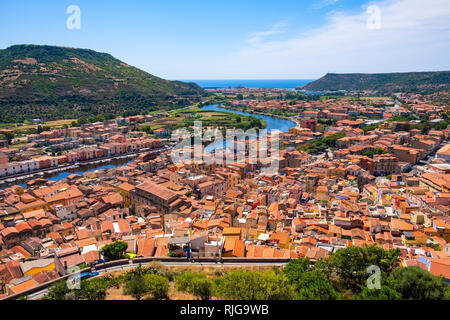Bosa, Sardinia / Italy - 2018/08/13: Panoramic view of the town of Bosa by the Temo river with Bosa Marina resort at the Mediterranean sea coast
