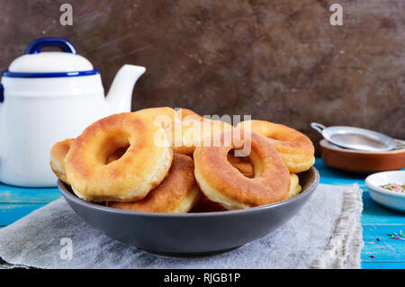 Homemade classic donuts with powdered sugar in the plate. Stock Photo