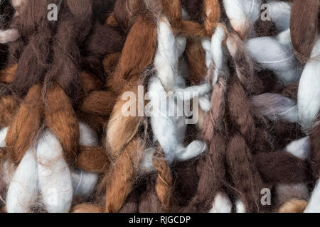 Knitting texture - pale blue, white and brown rustic knitted background close up Stock Photo