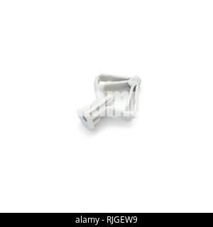 Plastic dowel for drywall isolated on white background.Direction of the dowel is diagonal. Stock Photo