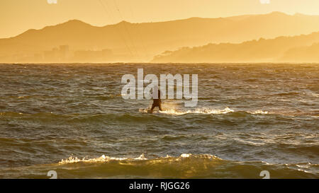 Kite surfer in a sunset light in a Spanish Costa Brava , near the town Palamos Stock Photo