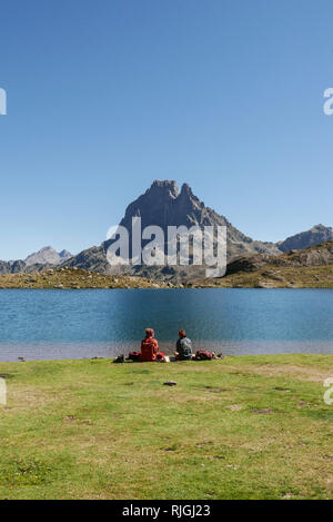Pic du Midi Ossau mountain and Lake Gentau, Ayous lake hiking trail, in the Ossau Valley, Pyrenees-Atlantiques department (south-western France). Two  Stock Photo