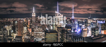 The iconic New York Skyline by night as seen from a skyscraper, Manhattan, NCY, USA Stock Photo