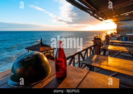 Sunset in Mui Ne beach, Phan Thiet, Southern Vietnam - Asia. View from a restaurant at the beach front. Stock Photo