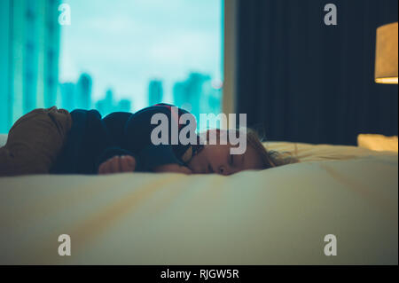 A little toddler is sleeping in a city apartment Stock Photo