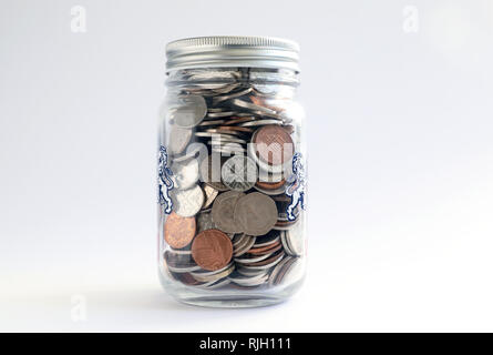 Jar of British coins Stock Photo