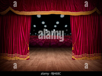 The red curtains are opening for the theater show Stock Photo