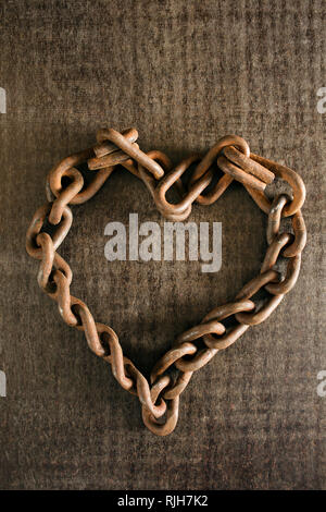 Rusty chain in heart shape Stock Photo