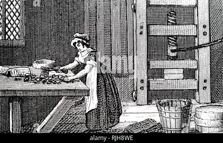 An engraving depicting a dairymaid breaking up curd during the manufacture of Cheshire cheese. Salt was then added to the curd before it was placed in the cheese press (right). Dated 19th century Stock Photo