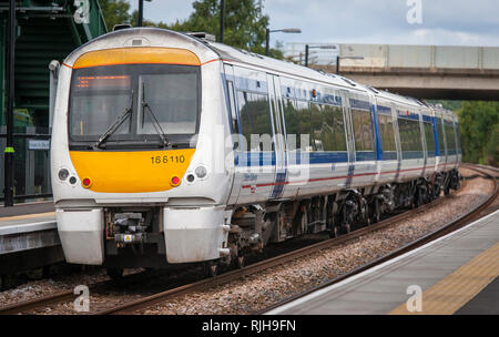 Class 168 Clubman passenger train in Chiltern Railways livery waiting at a station platform in the UK. Stock Photo