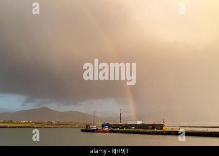 Dark clouds and rainbow over Valentia Island County Kerry, Ireland Stock Photo