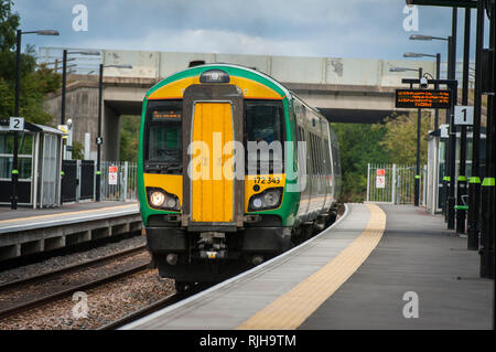 Class 172 Turbostar passenger train in London Midland livery waiting at a station platform in the UK. Stock Photo