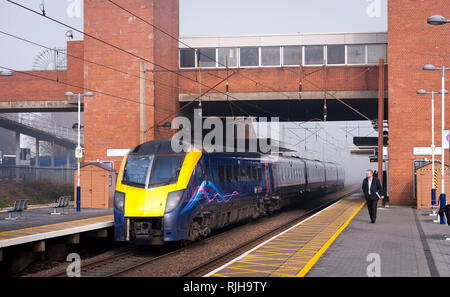 Class 180 Adelante passenger train in First Hull Trains livery at a railway station in England. Stock Photo