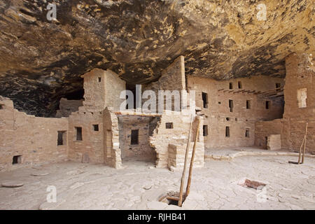 Ancient native american dwellings carved into a rock wall Stock Photo ...