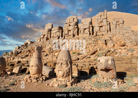 Statue heads at sunset, from right,  Lion, Eagle, Herekles & Apollo,  , east Terrace, Mount Nemrut or Nemrud Dagi Stock Photo