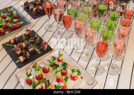 catering services background with snacks and colorful drinks on table. Stock Photo