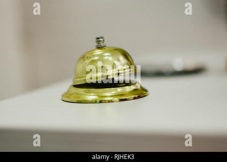 Old bell to call the bellman in a hotel, Service bell hotel golden. Stock Photo