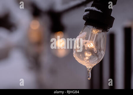 Color image of a frozen lit light bulb. Stock Photo