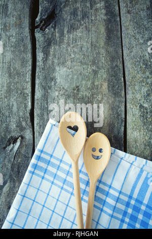 wooden spoons on kitchen table Stock Photo