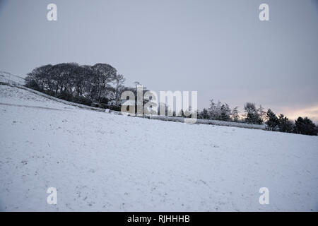 Snowy dawn in the Peak District National Park, England. Twilight light. Stock Photo