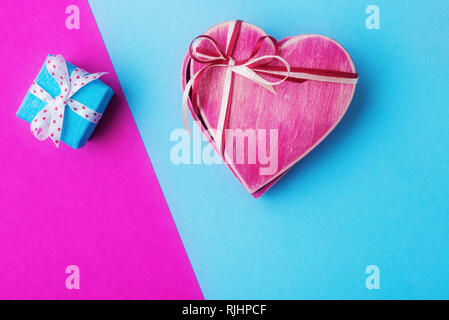 Gift boxes on pink and blue background. Valentines day concept Stock Photo