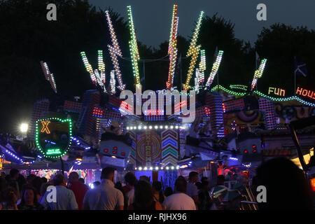 Fun fair in Gloucester Park, Gloucester, England, UK. The event is held annually in the city. August 2018 Stock Photo