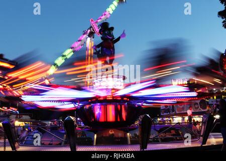 Fun fair in Gloucester Park, Gloucester, England, UK. The event is held annually in the city. August 2018 Stock Photo