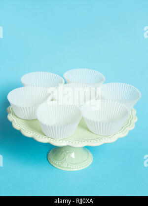 Vintage cake stand on blue background Stock Photo