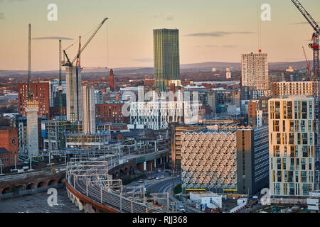 Manchester city centre skyline view across the rooftops from Salford from Wilburn Basin following the Ordsall Cord into the New Bailey area Stock Photo