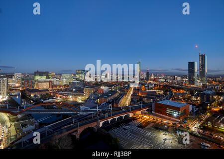 Manchester city centre skyline view across the rooftops from Salford  Beetham Tower, Liverpool Road, and MOSI Museum of Science and Industry site Stock Photo