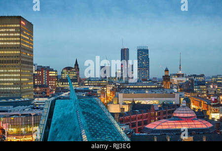 Manchester city centre skyline view across the rooftops from Hotel Indigo showing Urbis, Corn Exchange, Arndale House, and out to Beetham Tower Stock Photo