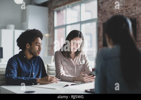Smartphone app developers in a business meeting Stock Photo
