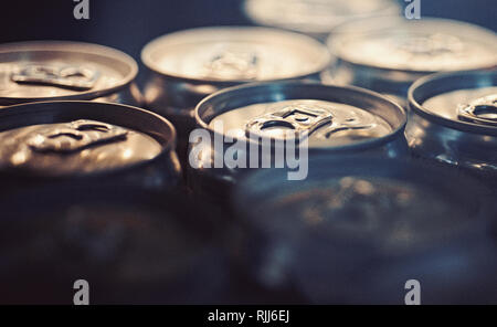Light refreshments. Aluminum beverage cans. Drink cans. Pull tabs on cans tops. Metal containers designed for packaging of drinks and food. Carbonated Stock Photo