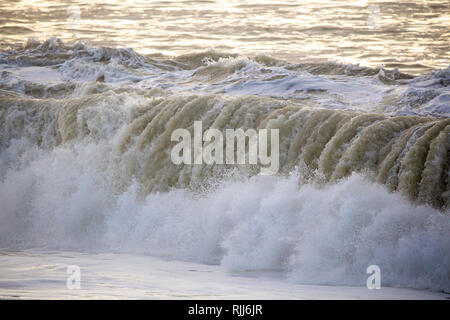 Dirty large crashing waves along the coast after a southerly has been through Stock Photo