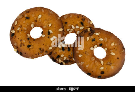 Top view of three bite size bagel chips with assorted seeds isolated on a white background. Stock Photo